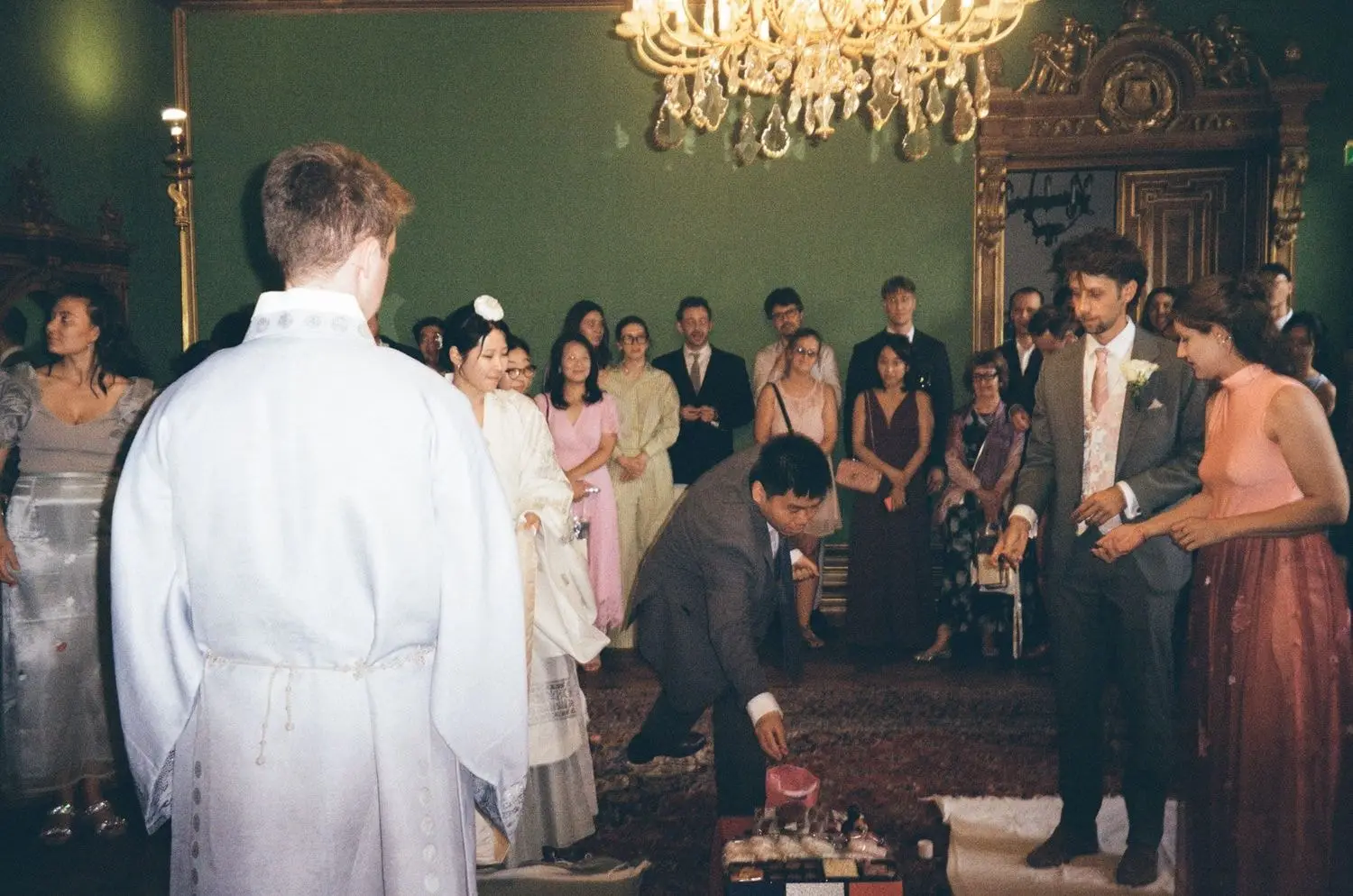 Korean paebaek ceremony in a green palace room, on 35mm film